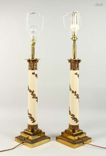 A GOOD PAIR OF CORINTHIAN COLUMN CANDLESTICKS on a square stepped base, converted to electricity.