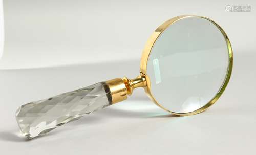 A MAGNIFYING GLASS with cut glass handle.