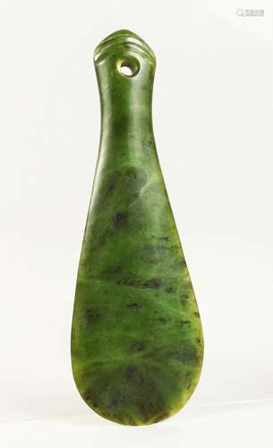 A MAORI CARVED HARDSTONE PADDLE FORM HAND CLUB, with carved and pierced end. 23cms long.