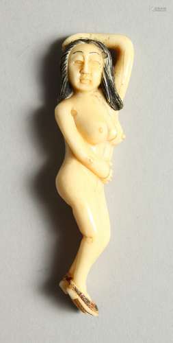 A CARVED BONE NUDE FIGURE. 3.5cms long.