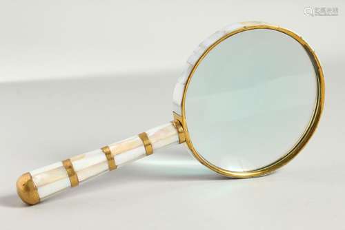 A MOTHER-OF-PEARL HANDLED MAGNIFYING GLASS.