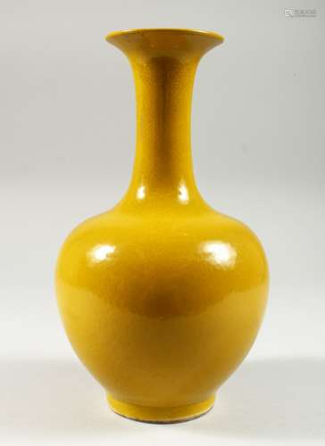 A CHINESE YELLOW GROUND PORCELAIN BOTTLE VASE. Six character mark in blue. 10ins high.