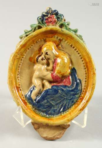 A SMALL PRATTWARE OVAL PLAQUE, Madonna and Child. 7ins x 4.5ins.