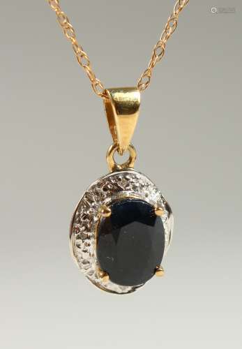 A 9CT GOLD OVAL SAPPHIRE AND DIAMOND NECKLACE on a chain, BOXED.