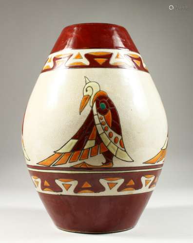 A LARGE ART DECO DESIGN POTTERY VASE, the side decorated with Deco type birds. 32cm high.