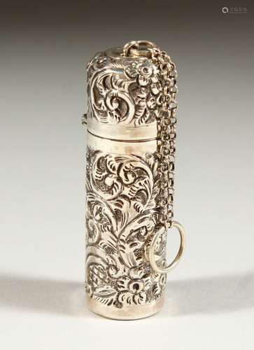 AN EDWARD VII SILVER SCENT BOTTLE with floral repousse decoration, scrolls and flowers with plain