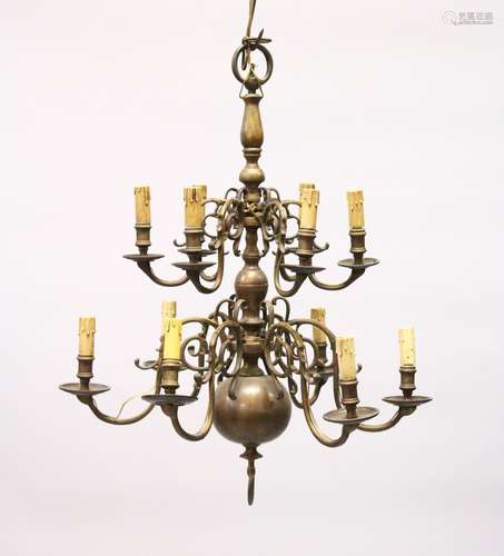 A GOOD DUTCH BRASS TWO TIER CHANDELIER with twelve scrolling branches. 2ft 5ins high x 2ft wide.