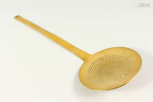 A LARGE 19TH CENTURY BRASS MILK SKIMMER. 2ft 1in long.