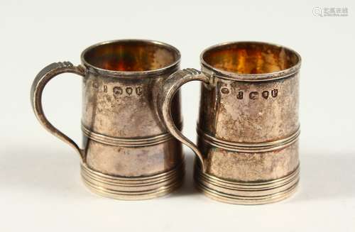 TWO VICTORIAN SILVER MINIATURE TANKARDS. London 1890. 4cms high.