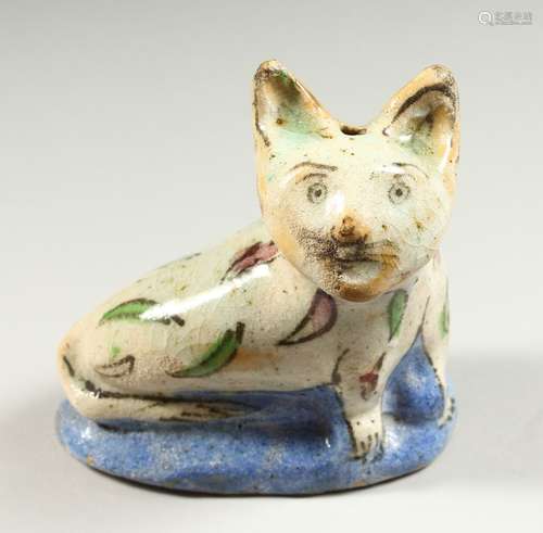 A SMALL PERSIAN POTTERY MODEL OF A CAT. 130cms long.