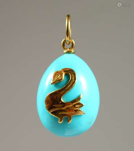 A GOLD MOUNTED TURQUOISE PENDANT.