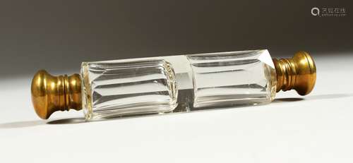 A VICTORIAN DOUBLE ENDED GLASS SCENT BOTTLE with brass caps.13cms long.