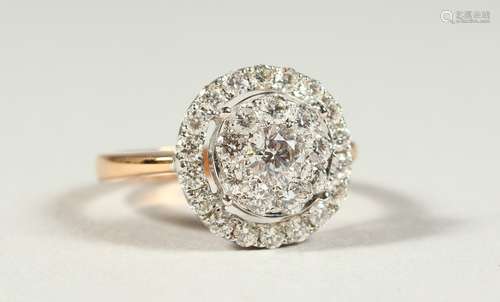 A SUPERB 18CT GOLD AND DIAMOND SET CIRCULAR CLUSTER RING, boxed.