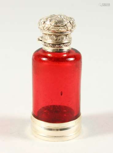 A VICTORIAN PLAIN RUBY GLASS CIRCULAR SCENT BOTTLE AND STOPPER with repousse silver top and plain