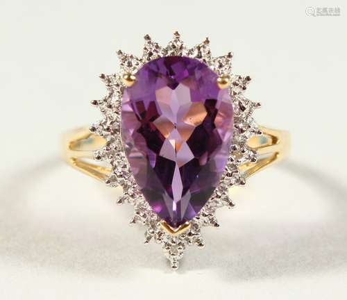 A GOOD 9CT GOLD TEAR DROP AMETHYST AND DIAMOND RING, boxed.