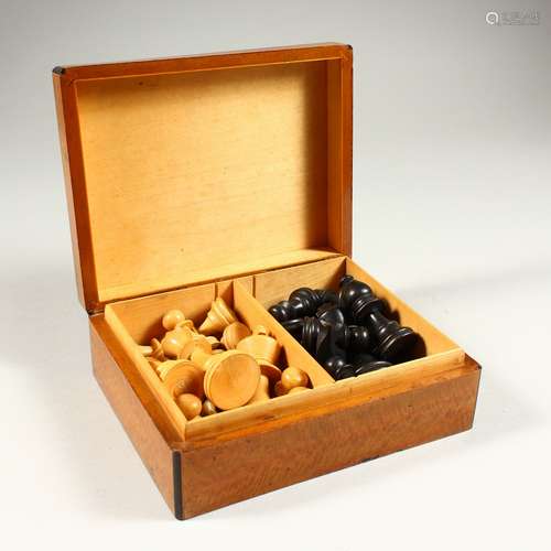 A BOXWOOD CHESS SET in a box.