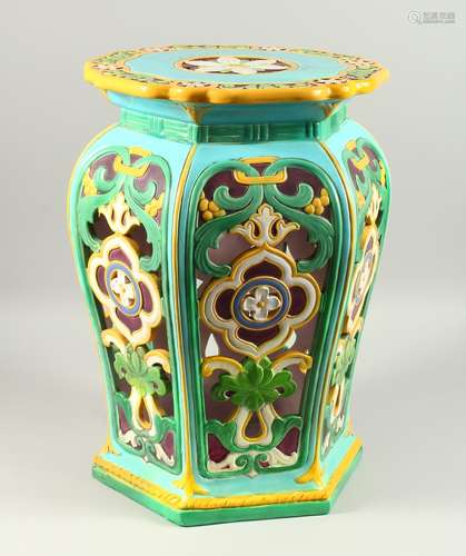 A MINTON MAJOLICA GARDEN SEAT, of hexagonal shape, with pierced sides and incised with flowers (