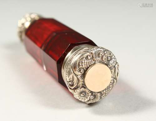 A VICTORIAN FACET CUT RUBY GLASS DOUBLE ENDED SCENT BOTTLE AND VINAIGRETTE with repousse silver