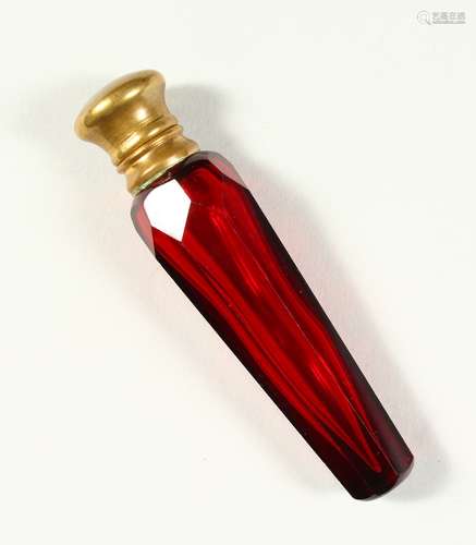 A VICTORIAN FACET CUT RUBY TAPERING GLASS SCENT BOTTLE AND STOPPER with plain cap. 10cms long.