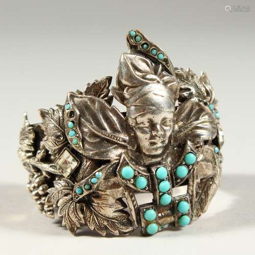 A SILVER BRACELET set with turquoise.