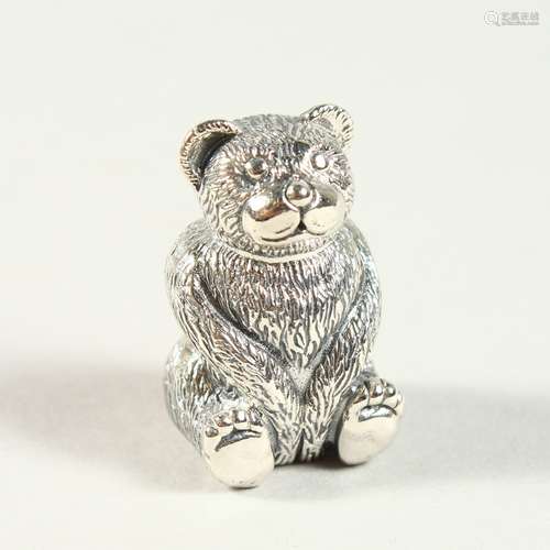 A NOVELTY SILVER TEDDY BEAR PIN CUSHION. 2.75cms high.