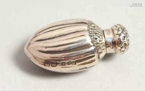 A SMALL VICTORIAN FLUTED SCENT BOTTLE with repousse stopper. Chester 1891. 4cms high.