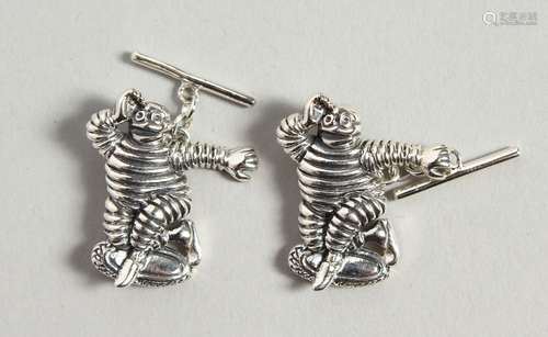 A PAIR OF NOVELTY MICHELIN MAN SILVER CUFFLINKS, boxed.