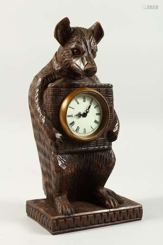 A GOOD BLACK FOREST TYPE WOOD BEAR CLOCK 30cms high.