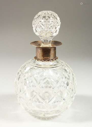 A LARGE CUT GLASS GLOBULAR SCENT BOTTLE AND STOPPER with silver band. 11cms diameter x 18cms high.