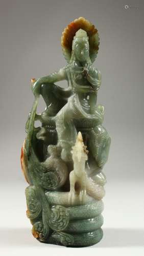 A GOOD CHINESE CARVED JADE GOD WITH A DOG. 9ins high.