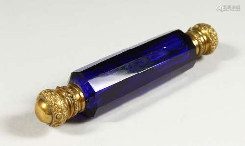 A VICTORIAN CUT BRISTOL BLUE FACET CUT DOUBLE ENDED SCENT BOTTLE with plated gilt tops. 13.5cms