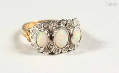 A 9CT GOLD THREE STONE OPAL AND DIAMOND RING, boxed.