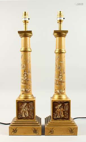 A PAIR OF TOLEWARE COLUMN LAMPS. 1ft 11ins high.