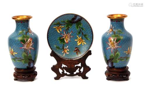 Pair of Japanese cloisonne vases with enamelled decoration of flowers on blue ground, together
