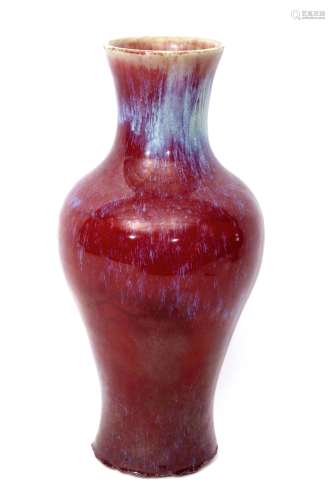 Chinese sang de boeuf vase, the baluster body with typical high fired glaze in tones of red and