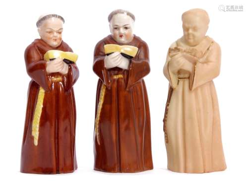 Group of three early 20th century Royal Worcester candle snuffers modelled as monks, one blush