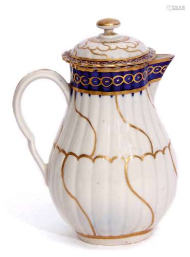 Worcester milk jug and cover circa 1780, with a swirling gilt design below a blue gilt border, the