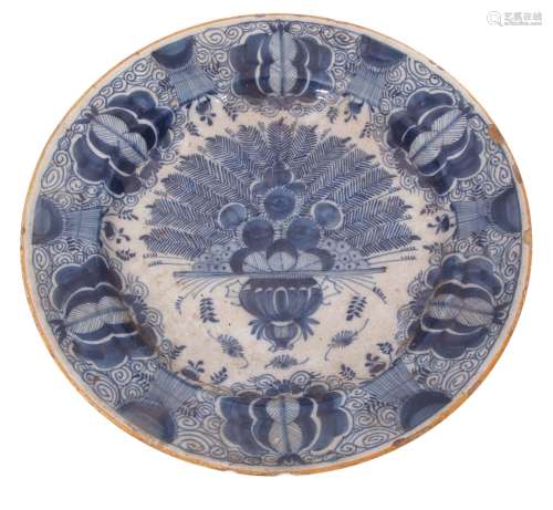 Dutch Delft charger decorated in a blue and white design in Chinese porcelain style within a