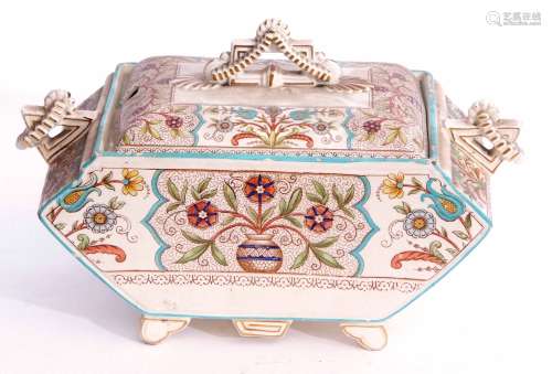 Late 19th century English pottery tureen and cover decorated in the aesthetic taste, standing on