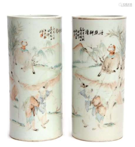 A pair of early 20th century Chinese porcelain vases of cylindrical form, with enamelled
