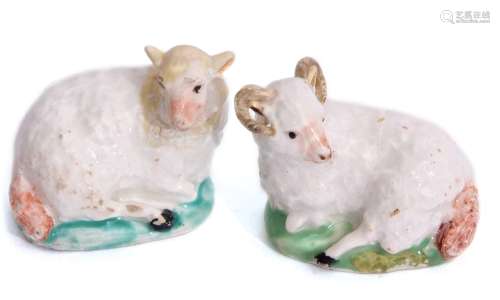 Lowestoft porcelain sheep and a ram both circa 1780, the models seated on green bases with black