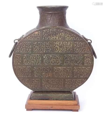 Chinese bronze vessel of oval form with loop handles decorated with archaistic scrolls, 45cm high