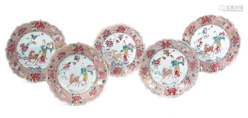 Group of five 18th century Qianlong period famille rose dishes with pie-crust rims, the centres