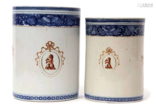 Pair of Chinese porcelain export tankards with interlaced handles decorated with an armorial