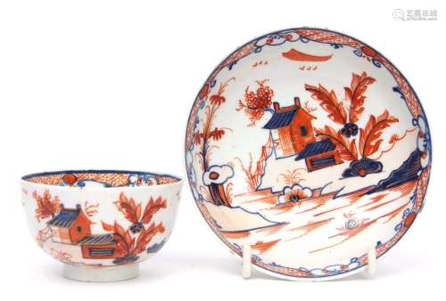 Lowestoft porcelain tea bowl and saucer decorated in iron red and blue with the doll's house