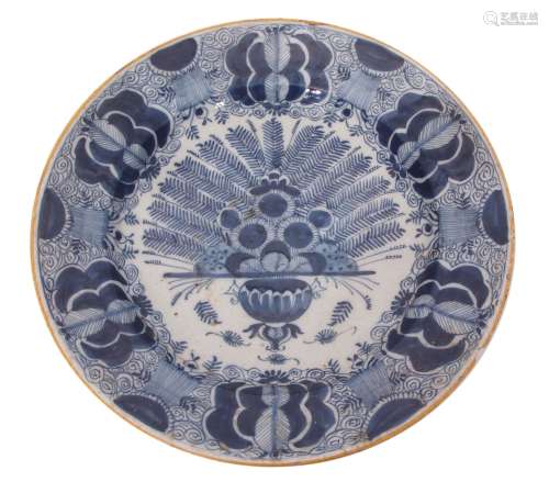 Delft charger with blue and white porcelain style design within a yellow rim