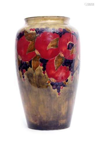 Early 20th century Moorcroft vase decorated with the Pomegranate pattern on green ground, signed