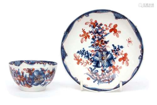 Lowestoft porcelain tea bowl and saucer circa 1780, the blue and white design clobbered with a