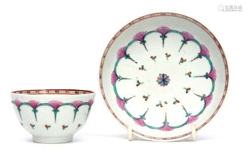 Lowestoft tea bowl and saucer, circa 1780, polychrome design, in a so-called Bungay pattern, the