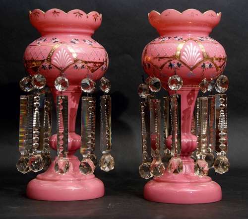 Pair of pink glass table lustres with gilded and painted floral decoration, 40cm high